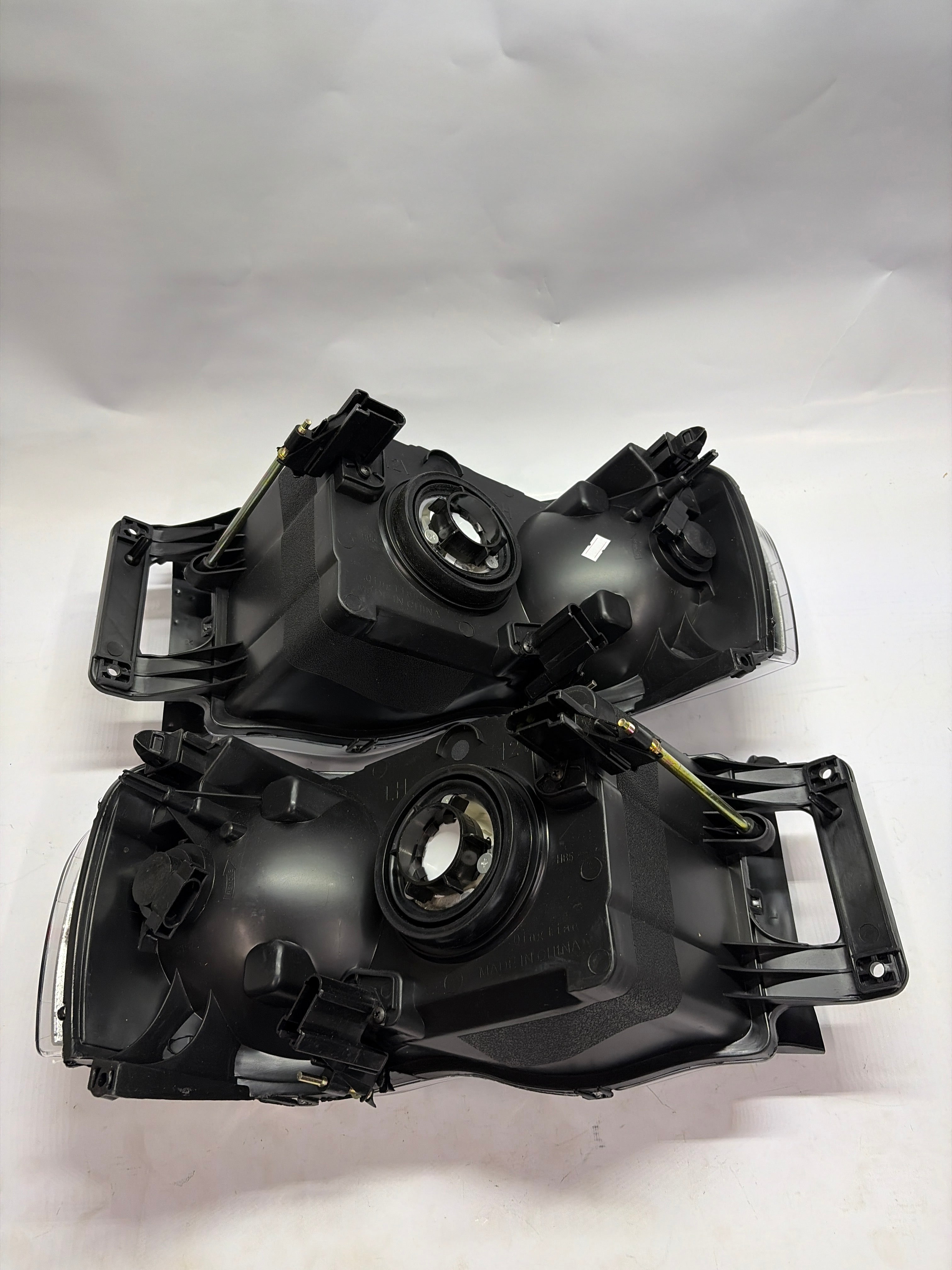 02-05 DODGE RAM 1500 black housing pair of headlights