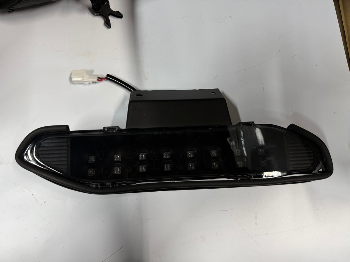 Actual black housing smoked lens third brake light - front
