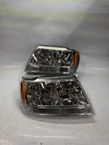99-04 JEEP GRAND CHEROKEE CHROME HOUSING AMBER CORNER HEADLIGHTS