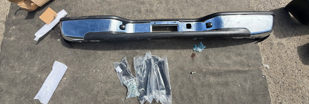AS IS BUMPER FOR 99-06 CHEVY SILVERADO AND GMC SIERRA REAR CHROME WITH BRACKETS AND HARDWARE AVAILABLE