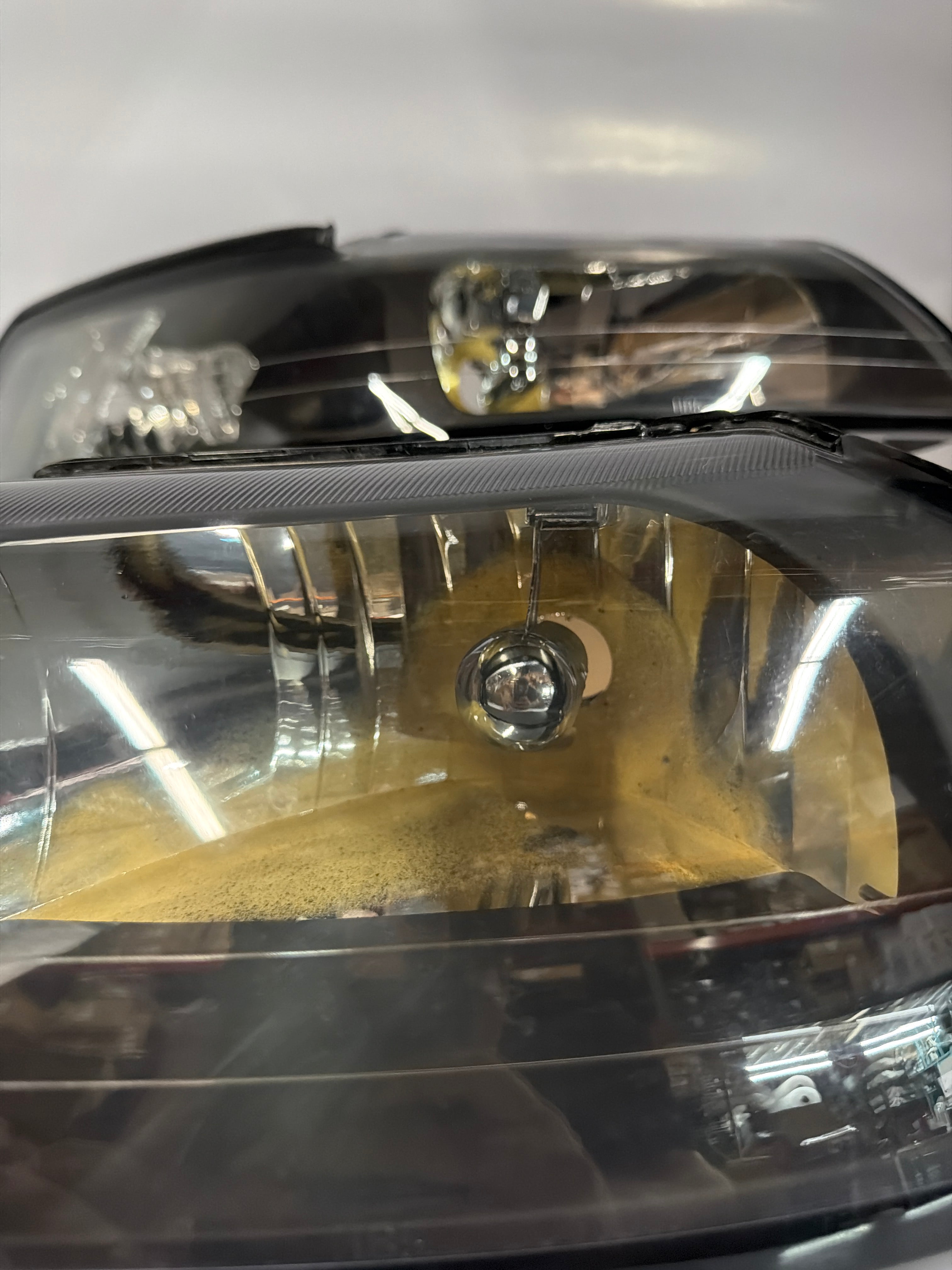 AS IS 99-04 FORD MUSTANG BLACK HOUSING AND CLEAR WITH CLEAR HEADLIGHTS