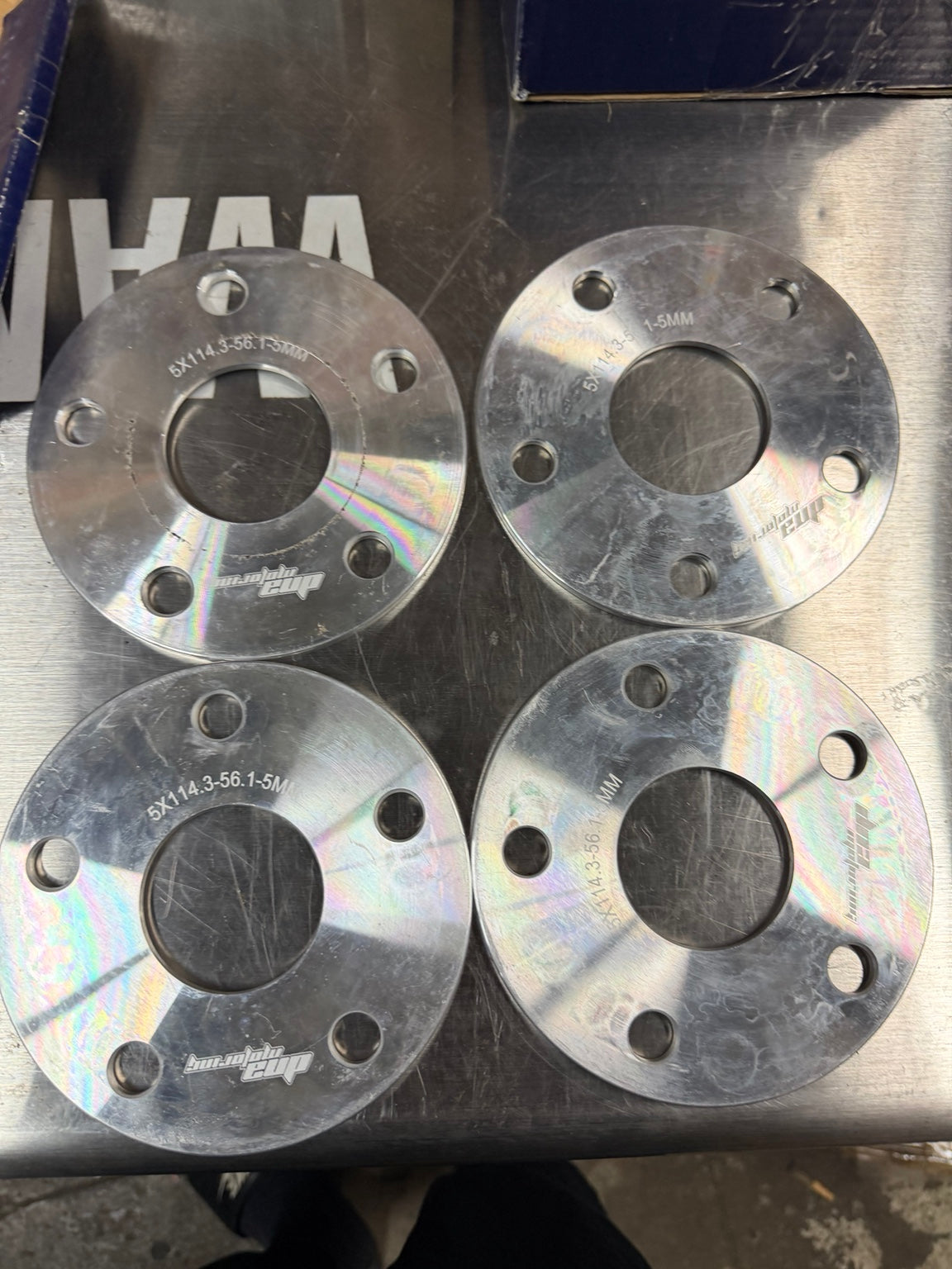 Four 5 mm wheel spacers - 5x114.3, 56.1 mm bore - front markings