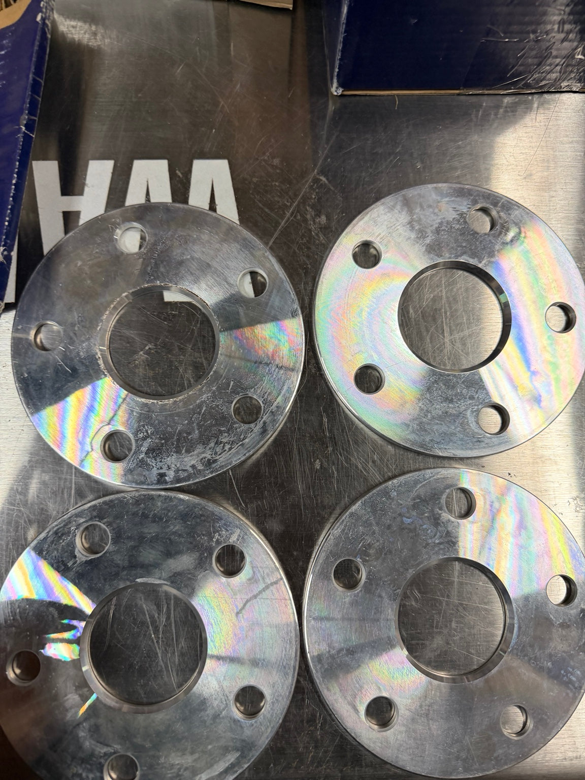Close view of scratches and surface marks on the four spacers