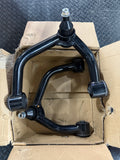 Actual open-box slightly used FUCA-ZTL-112 upper control arm pair, black with visible scuffs