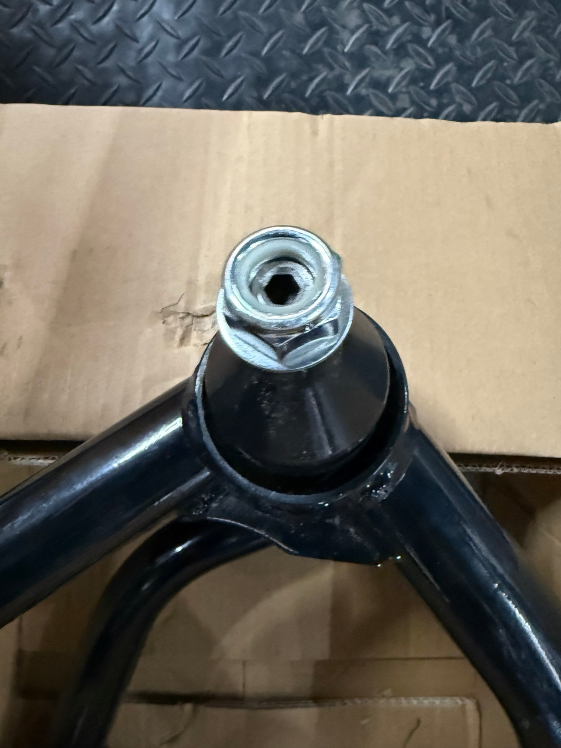 Actual control arm second ball joint and visible surface wear