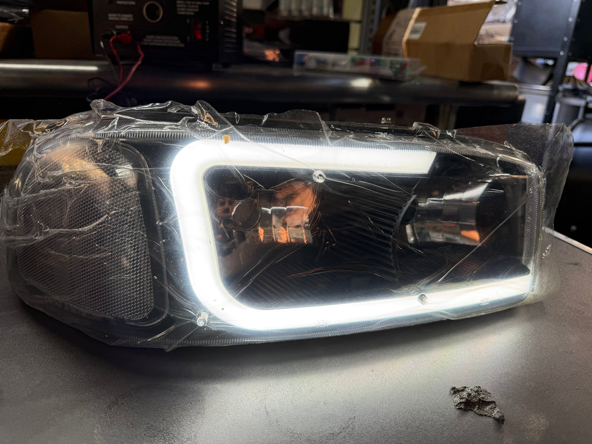 Actual headlight with white LED running light illuminated