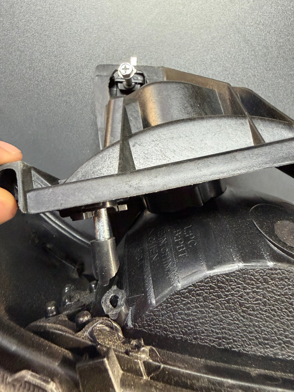 Right headlight broken mounting area detail