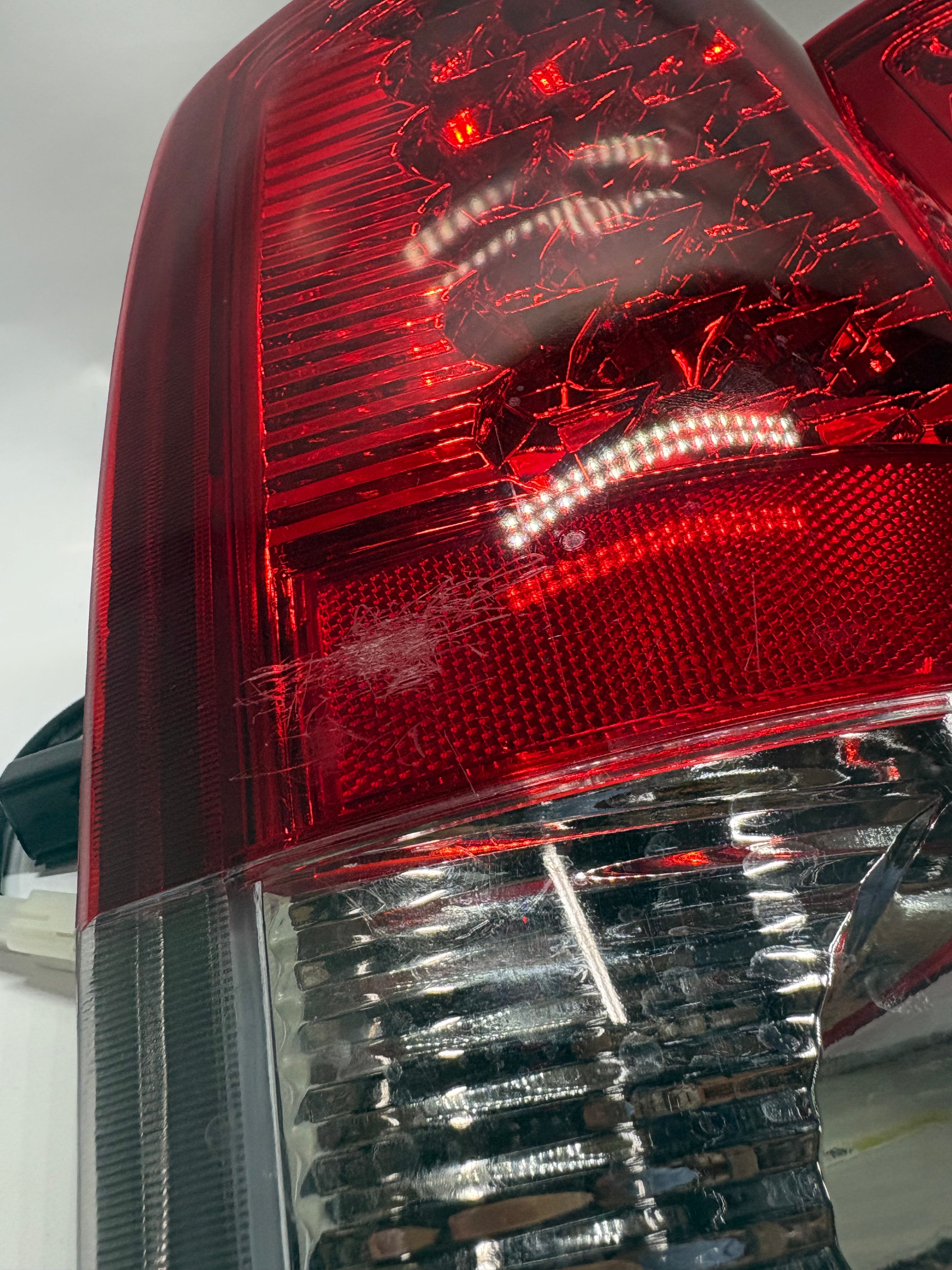 OB-TL-DRAM05-LED-CH-RD 02-06 DODGE RAM red led taillights chrome Driver Side Scratched