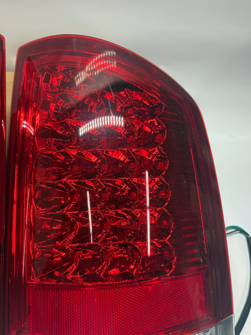 OB-TL-DRAM05-LED-CH-RD 02-06 DODGE RAM red led taillights chrome Driver Side Scratched