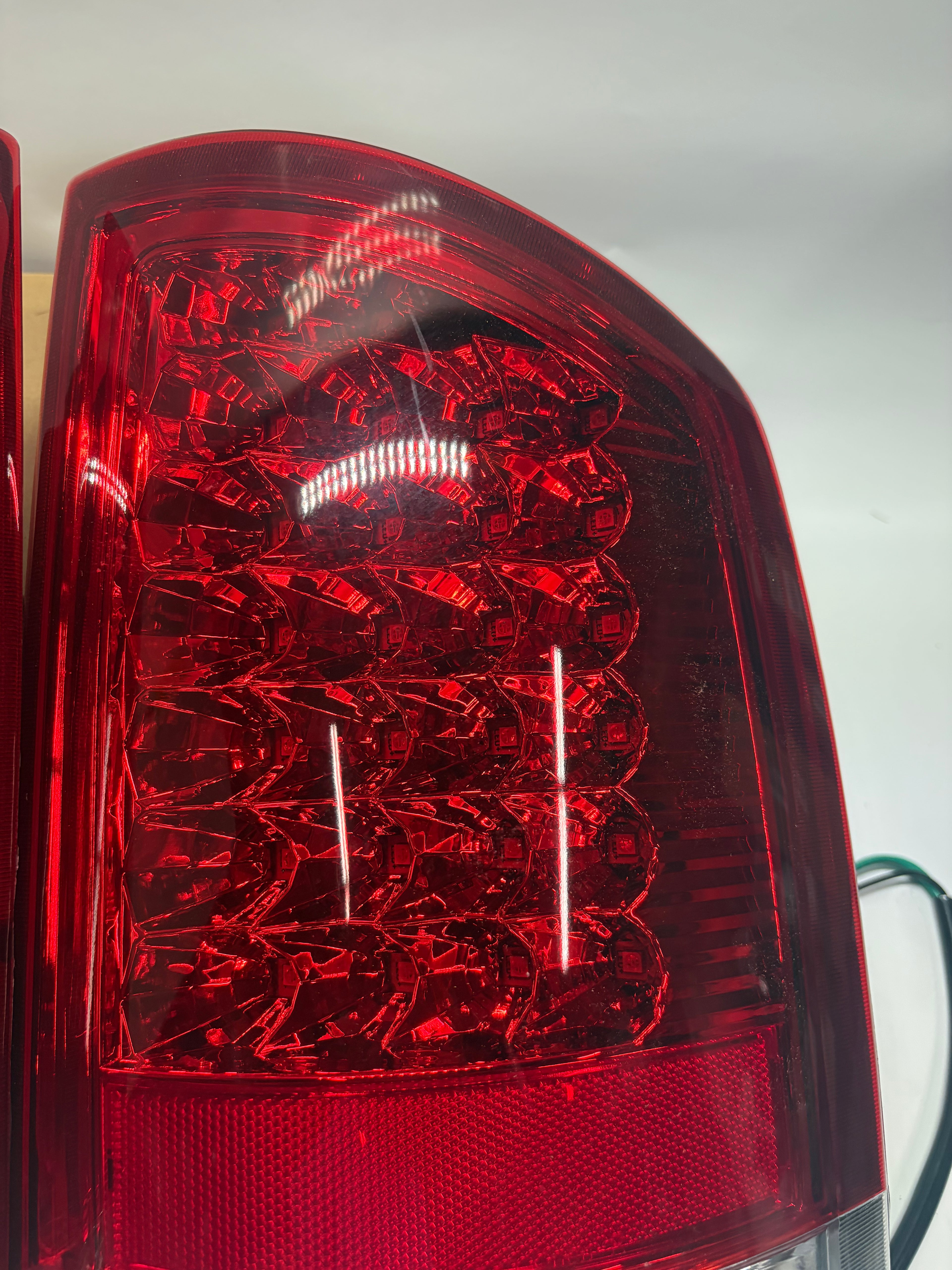 OB-TL-DRAM05-LED-CH-RD 02-06 DODGE RAM red led taillights chrome Driver Side Scratched