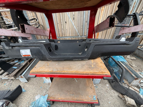 #50 17-22 FORD F250 / F350 BROKEN PLASTICS BLACK REAR BUMPER