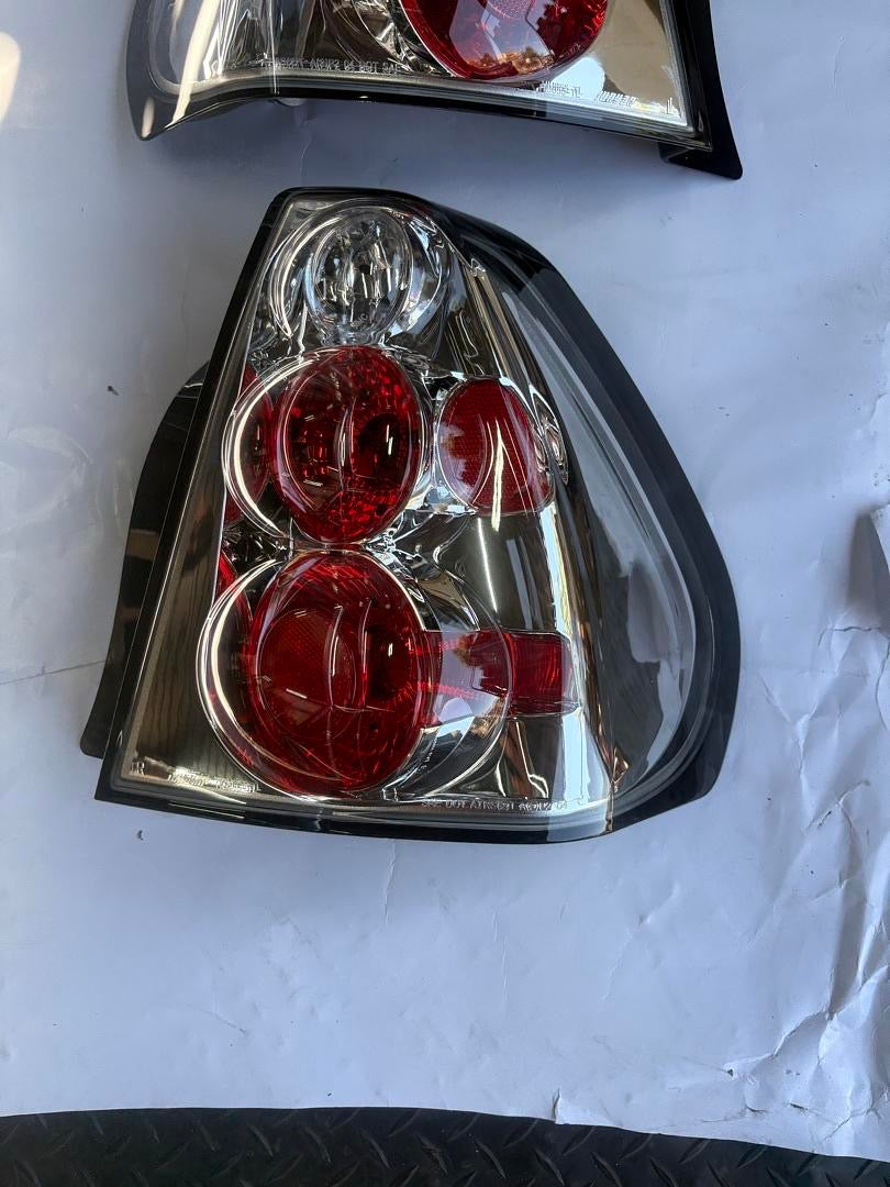 04-07 CHEVY MALIBU CHROME HOUSING TAILLIGHTS