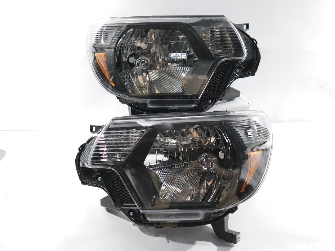 REFURBISHED 12-15 TOYOTA TACOMA BLACK AMBER HEADLIGHTS