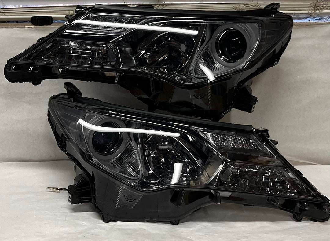 REFURBISHED 13-15 TOYOTA RAV4 BLACK HOUSING AND CLEAR WITH PROJECTOR HEADLIGHTS