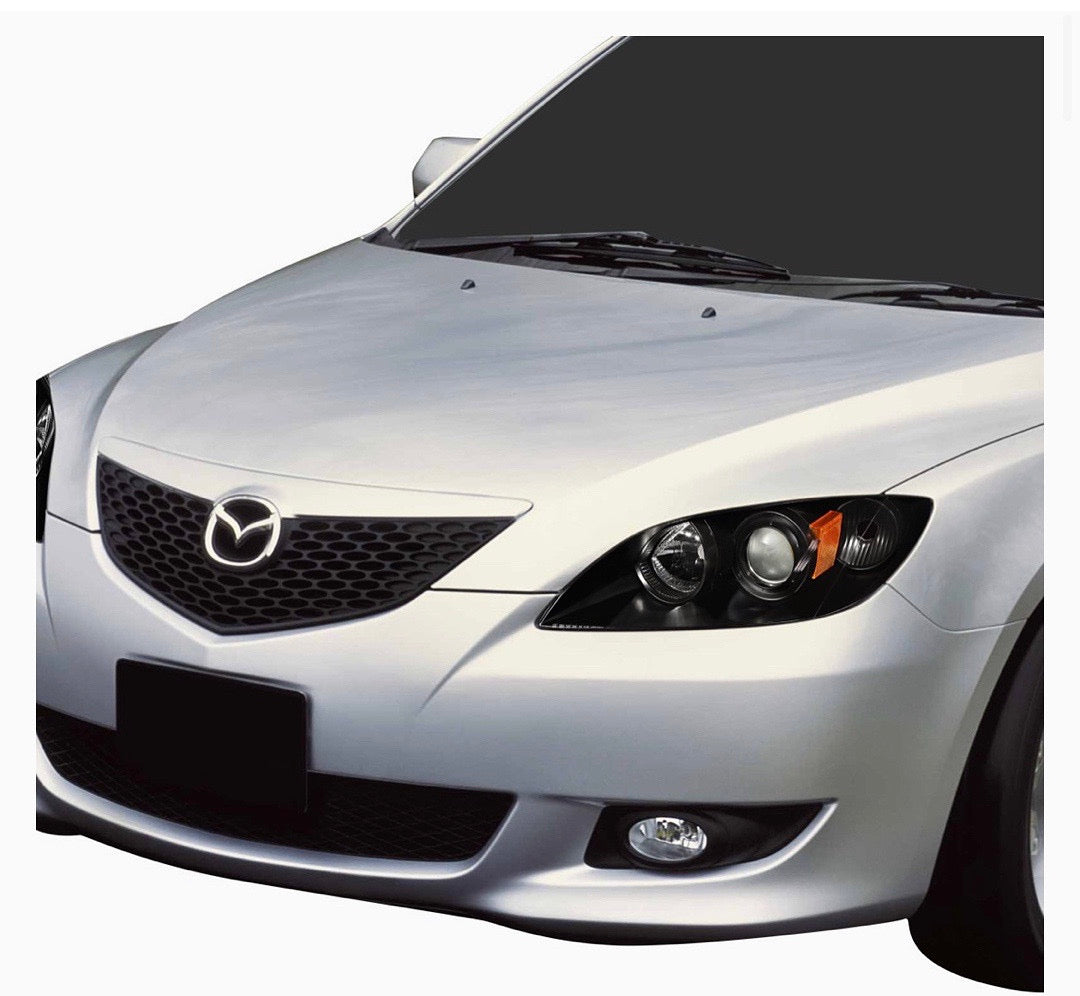 04-09 MAZDA 3 4DR BLACK HOUSING AND CLEAR PROJECTOR HEADLIGHTS
