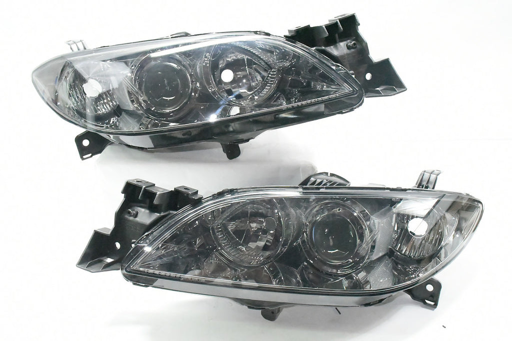 04-09 MAZADA 3 4DR CHROME HOUSING AND SMOKED WITH PROJECTOR HEADLIGHTS