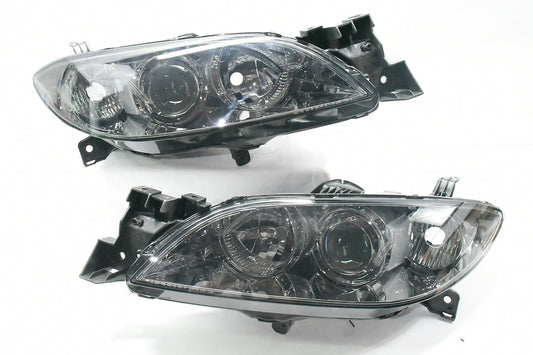 04-09 MAZADA 3 4DR CHROME HOUSING AND SMOKED WITH PROJECTOR HEADLIGHTS