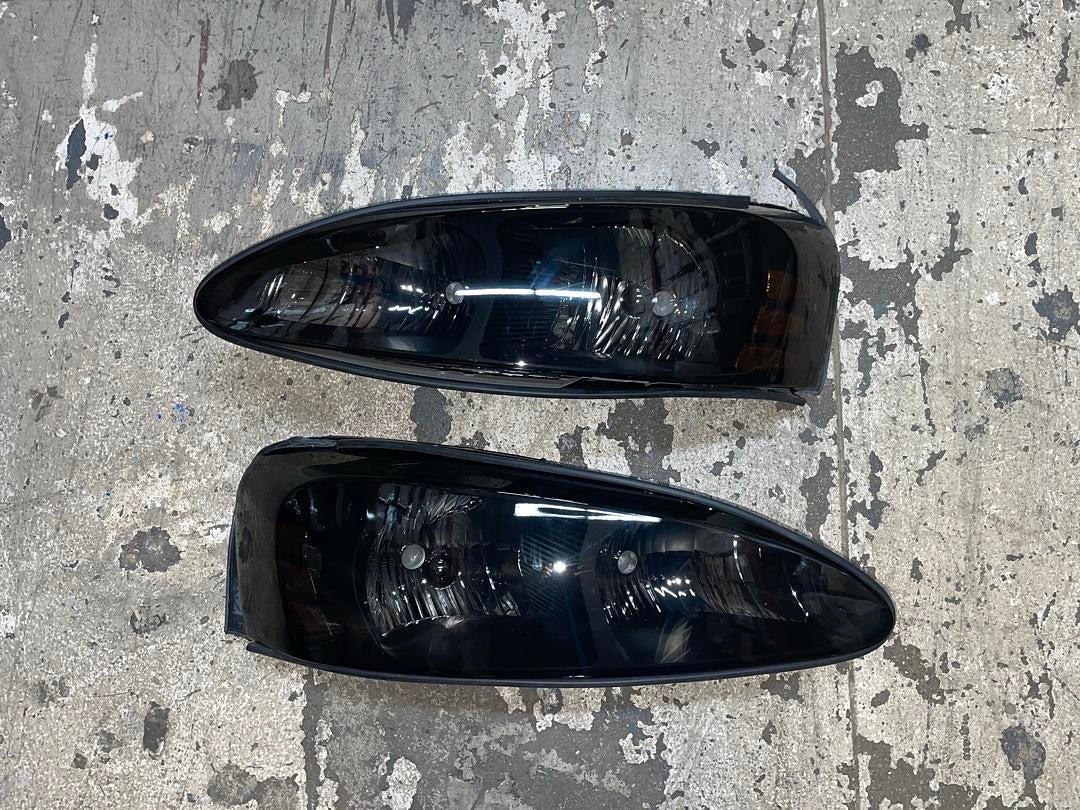 04-08 PONTIAC GRAND PRIX black smoked amber headlights
