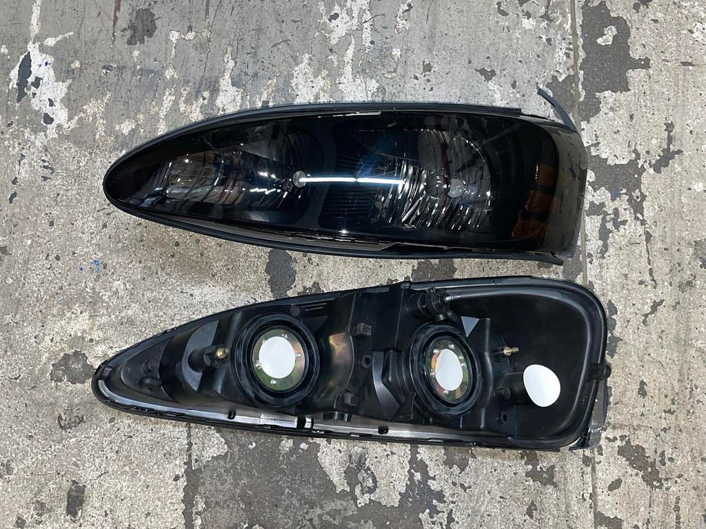 04-08 PONTIAC GRAND PRIX black smoked amber headlights