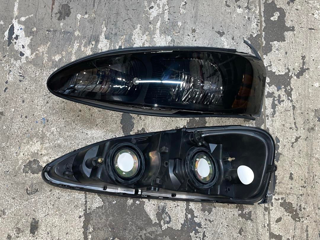 04-08 PONTIAC GRAND PRIX black smoked amber headlights