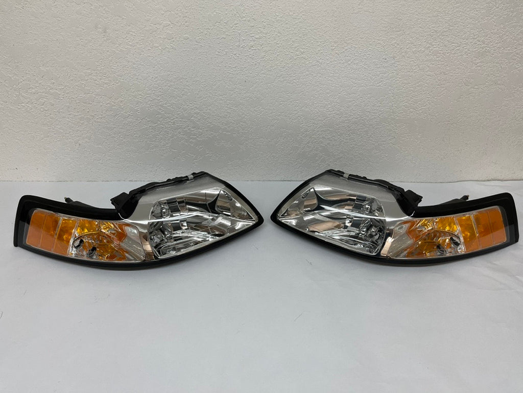 99-04 FORD MUSTANG CHROME HOUSING AND CLEAR WITH AMBER HEADLIGHTS