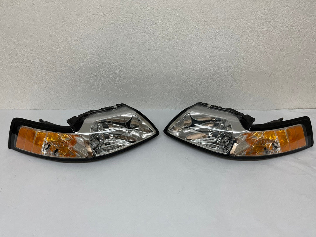 99-04 FORD MUSTANG CHROME HOUSING AND CLEAR WITH AMBER HEADLIGHTS