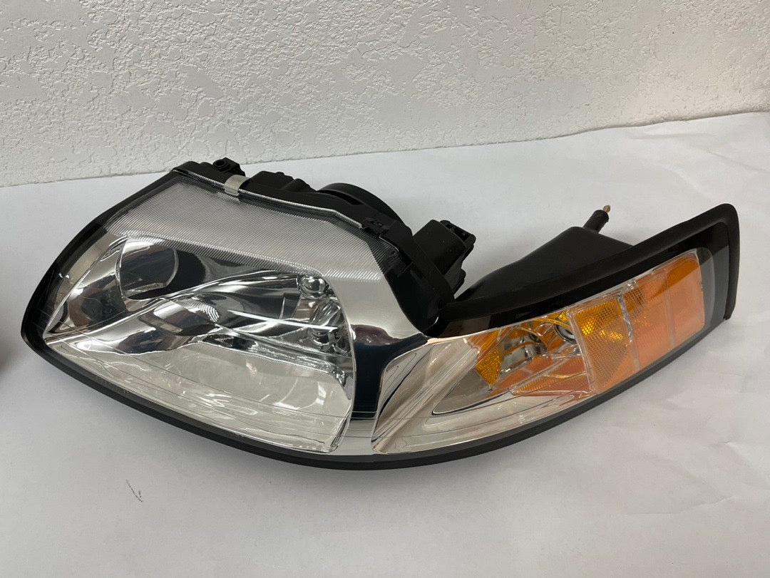 99-04 FORD MUSTANG CHROME HOUSING AND CLEAR WITH AMBER HEADLIGHTS