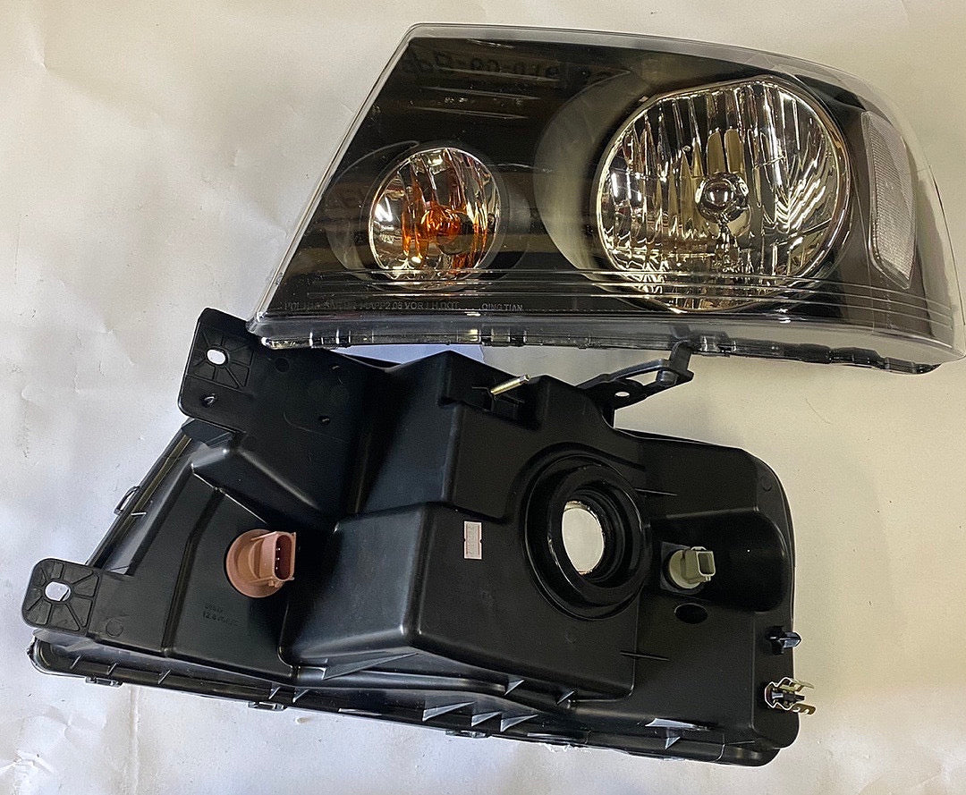 REFURBISHED 04-08 FORD F-150 BLACK HOUSING HEADLIGHTS