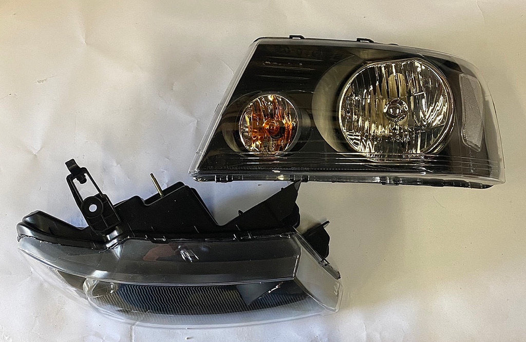 REFURBISHED 04-08 FORD F-150 BLACK HOUSING HEADLIGHTS