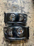 06-08 DODGE RAM HEADLIGHTS BLACK HOUSING