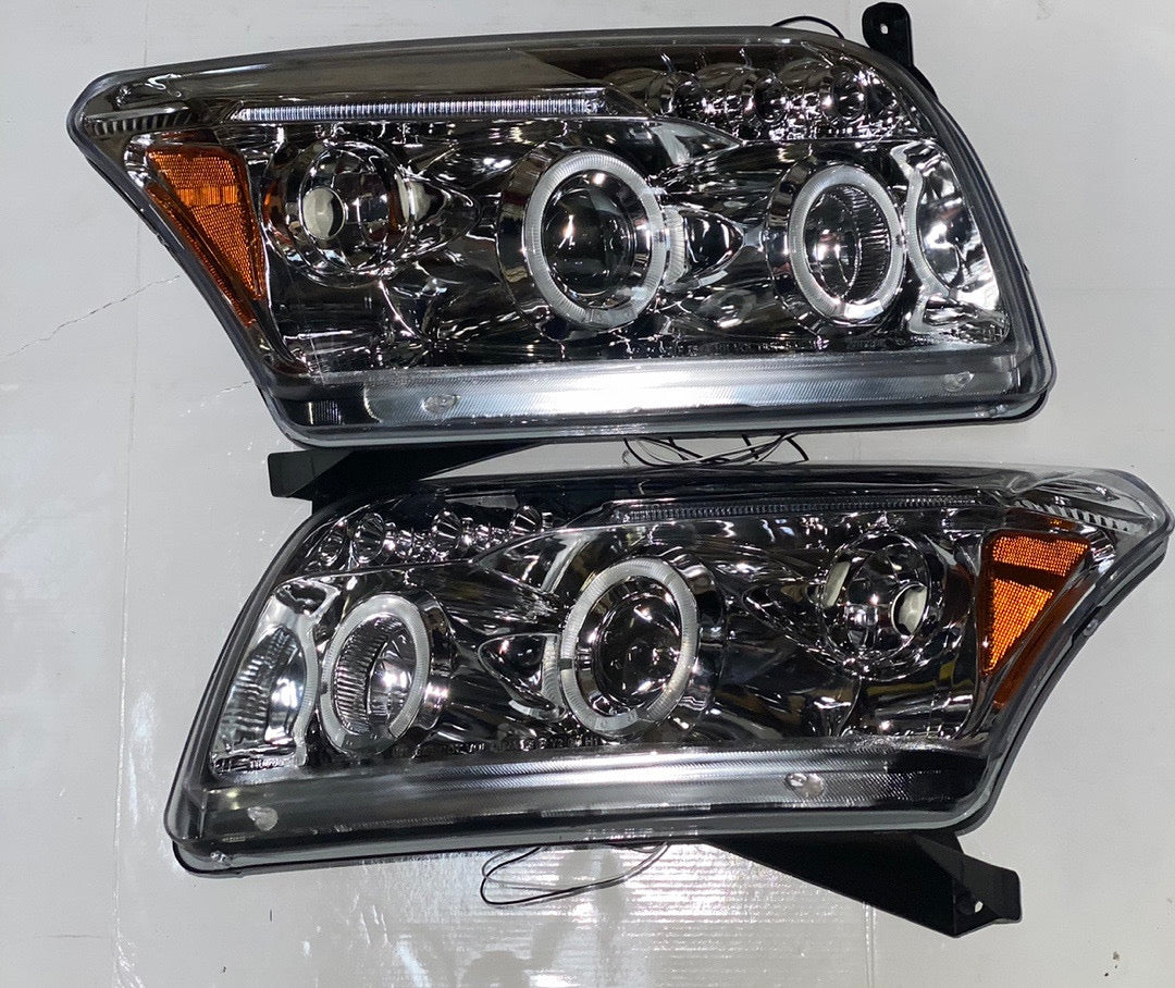 07-10 DODGE CALIBER CHROME HOUSING AMBER PROJECTOR HALOGEN HEADLIGHTS