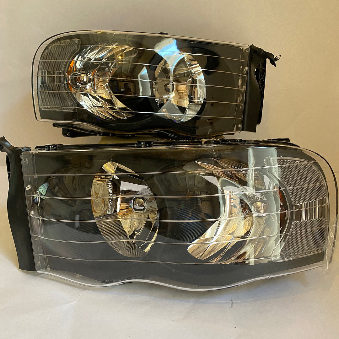 02-05 DODGE RAM 1500 black housing pair of headlights