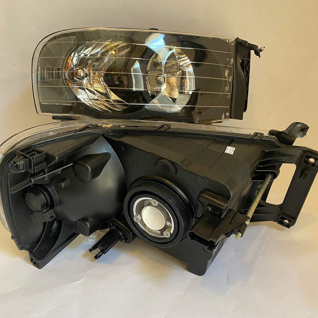 02-05 DODGE RAM 1500 black housing pair of headlights