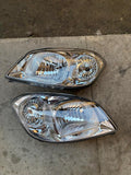 NEW 05-10 CHEVY COBALT PONTIAC G5 PURSUIT HEADLIGHTS - CHROME HOUSING CLEAR CORNER
