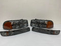 99-06 GMC SIERRA SMOKED HOUSING WITH AMBER REFLECTOR HEADLIGHTS