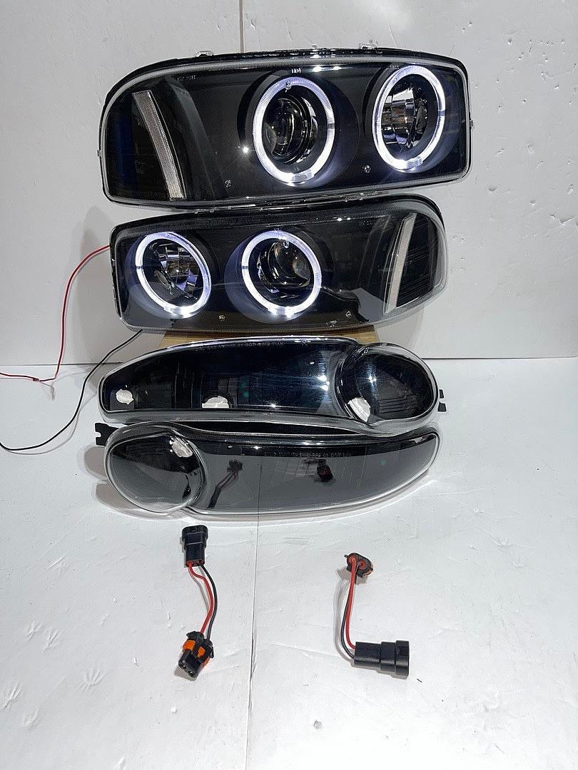 01-06 GMC DENALI BLACK HOUSING WITH CLEAR REFLECTOR HEADLIGHTS HALOGEN
