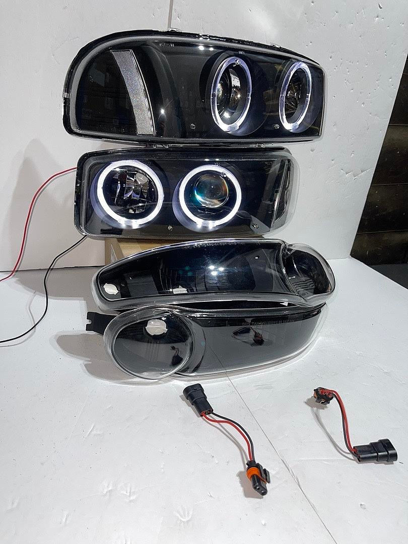 01-06 GMC DENALI BLACK HOUSING WITH CLEAR REFLECTOR HEADLIGHTS HALOGEN