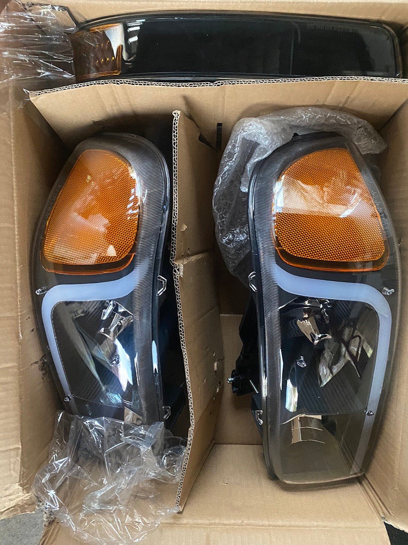 REFURBISHED 99-06 GMC SIERRA / YUKON BLACK AMBER WITH LED HEADLIGHTS