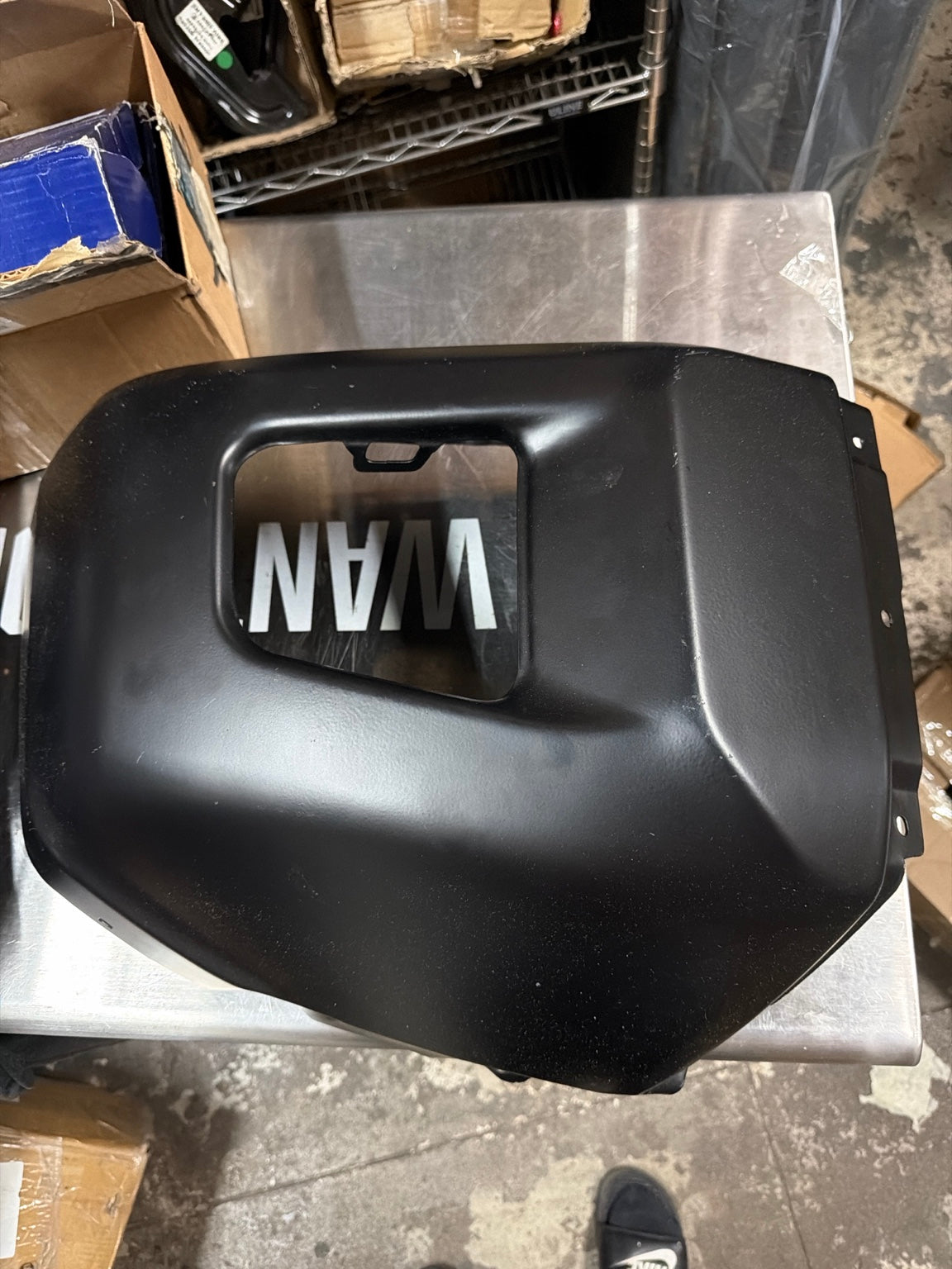 Actual left black Tundra bumper end cap with light scratching, front view