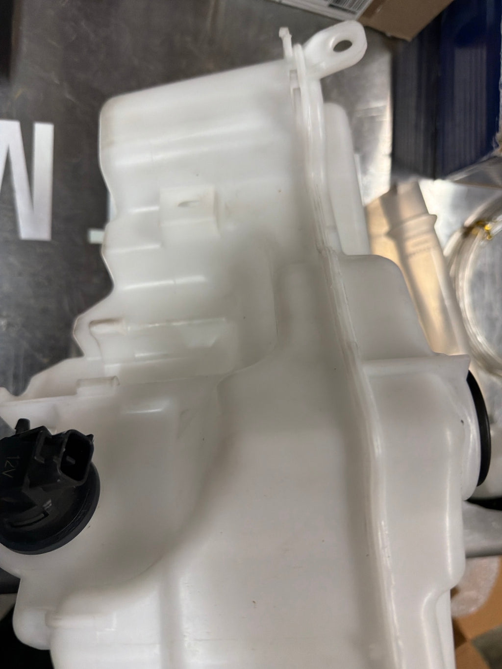Actual side of reservoir with fitting