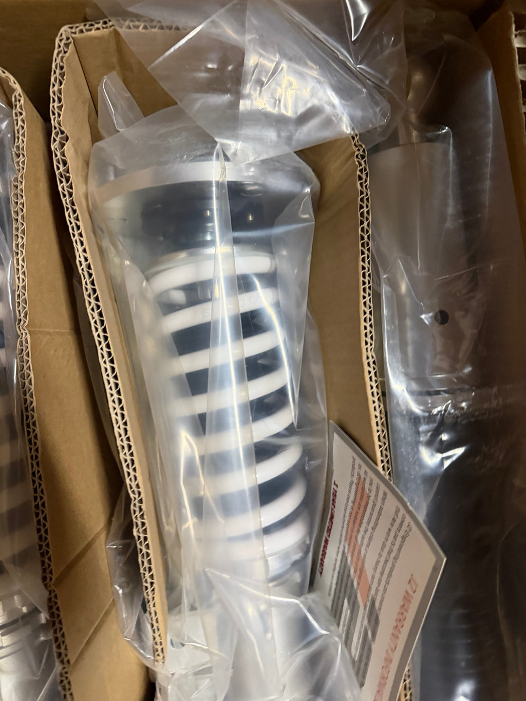 J2 Engineering J2-CO-060-WS white spring suspension kit in original packaging