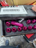 JDM Racing pink M12x1.5 lug nut kit photographed in box, SKU PT-ZTL-9023-15-PK