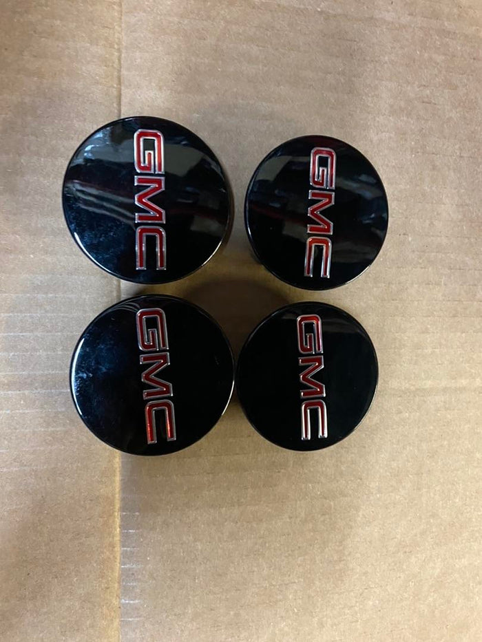 9595010 | Oem # 10-16 gmc acadia oem center caps black and red 2 1/2 inch center caps