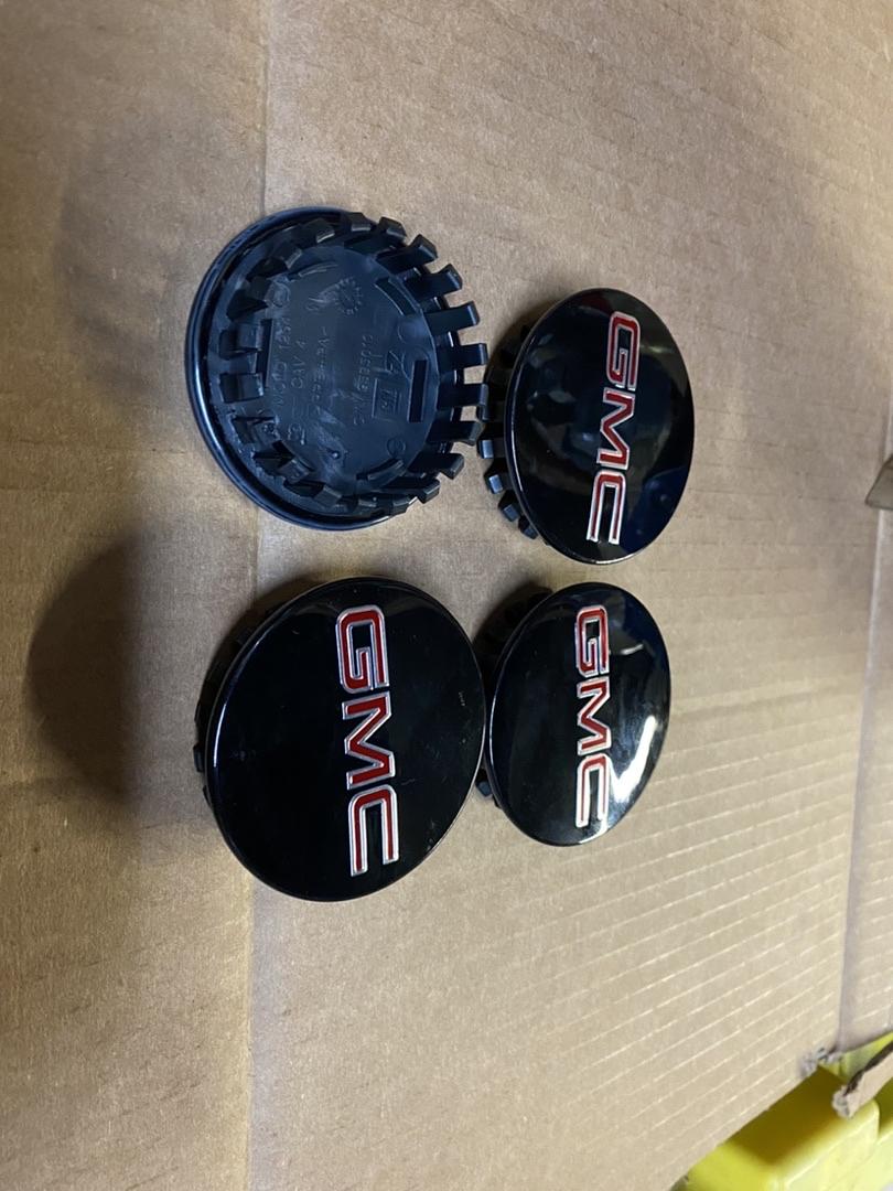 9595010 | Oem # 10-16 gmc acadia oem center caps black and red 2 1/2 inch center caps