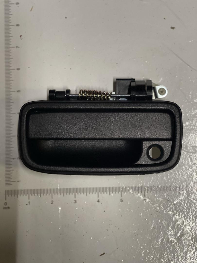 95-04 TOYOTA TACOMA DRIVER SIDE HANDLE BEZEL WITH KEY HOLE