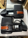 Actual black towing mirror pair with amber signal lenses