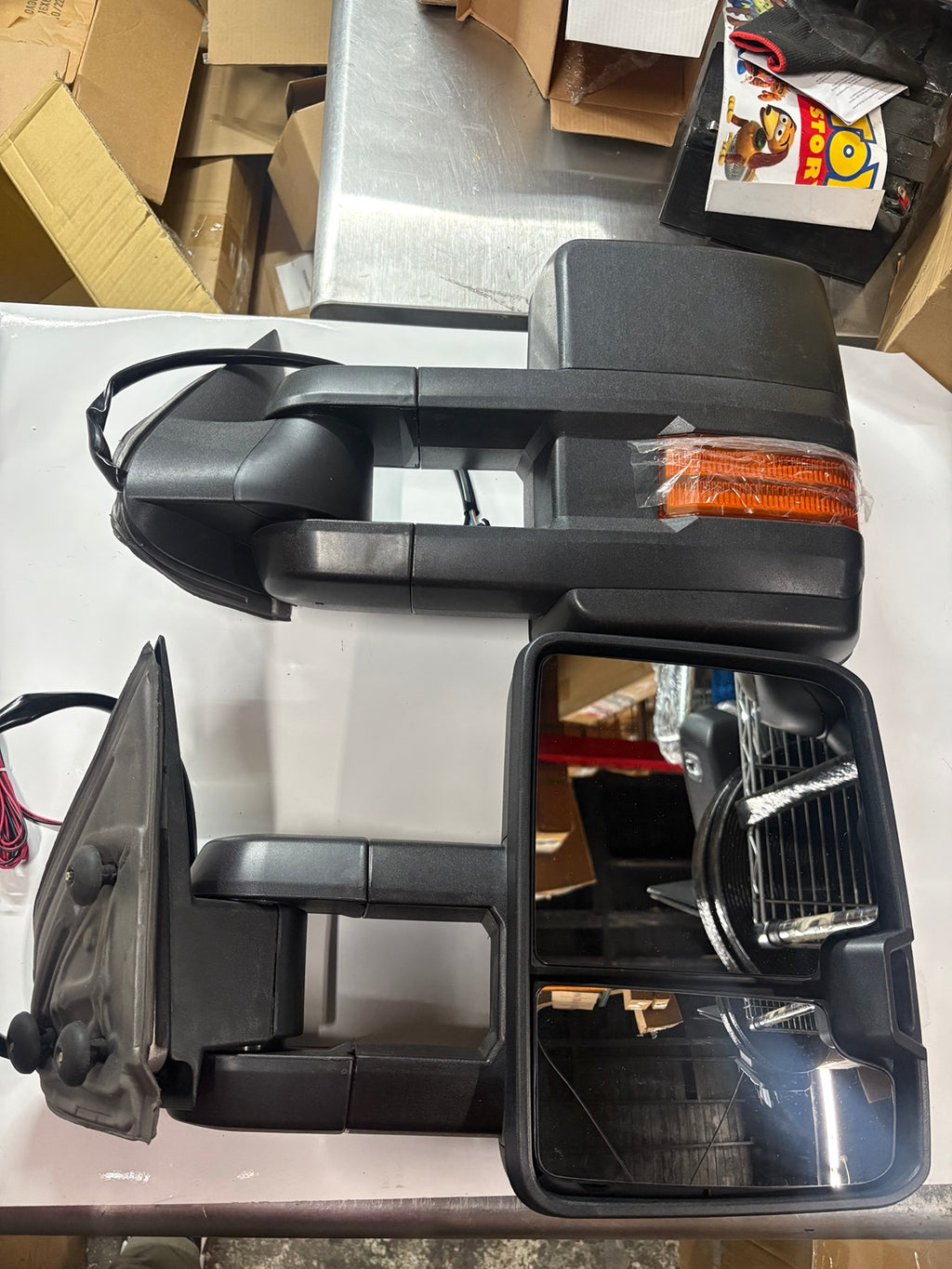 Towing mirror pair showing mirror glass and amber signal lens