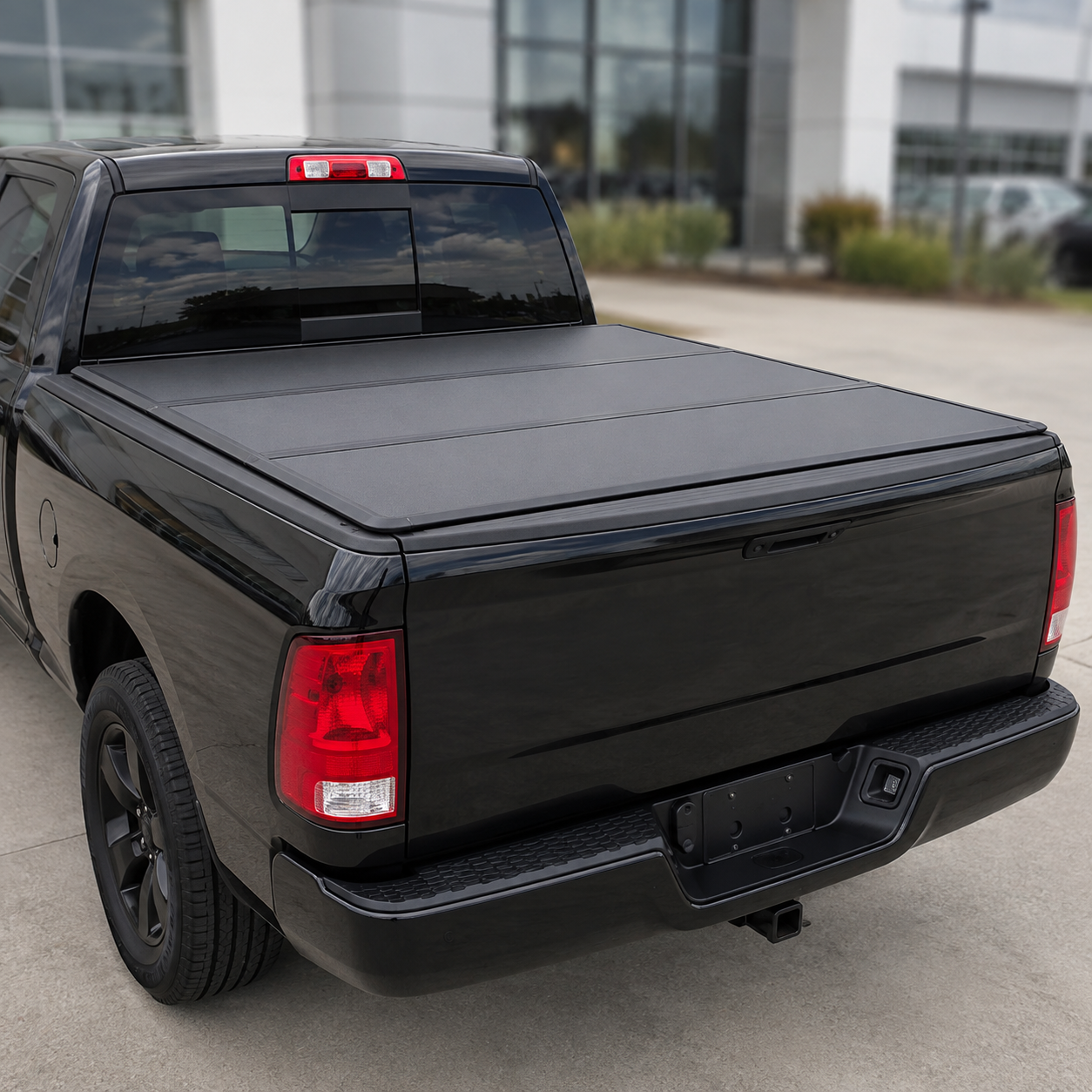 Black flush hard tri-fold cover on pickup truck