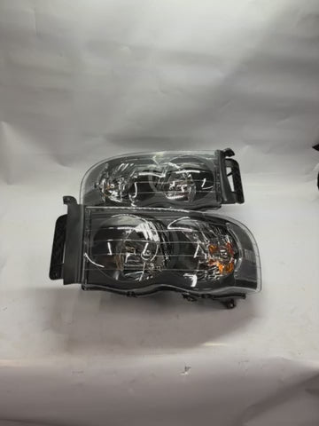 02-05 DODGE RAM 1500 black housing pair of headlights